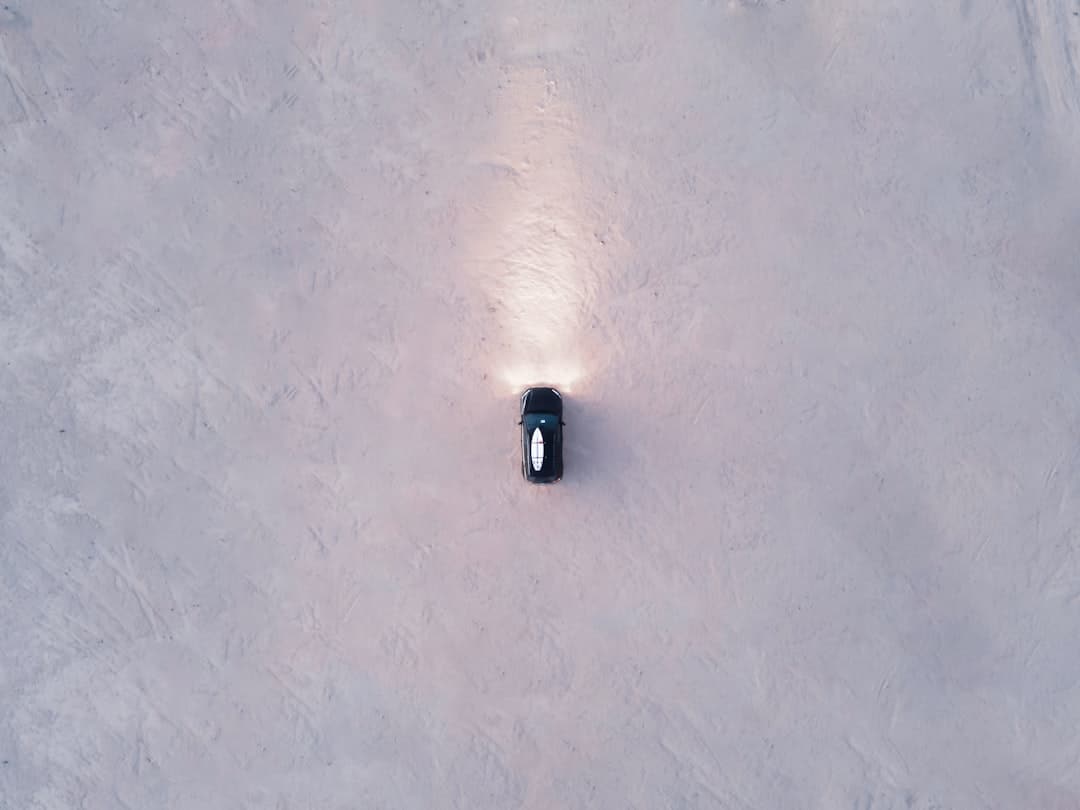 A minimalist photo of a clean road splitting into two distinct paths, representing the 'Great Decoupling' and the choice facing real estate brokers.