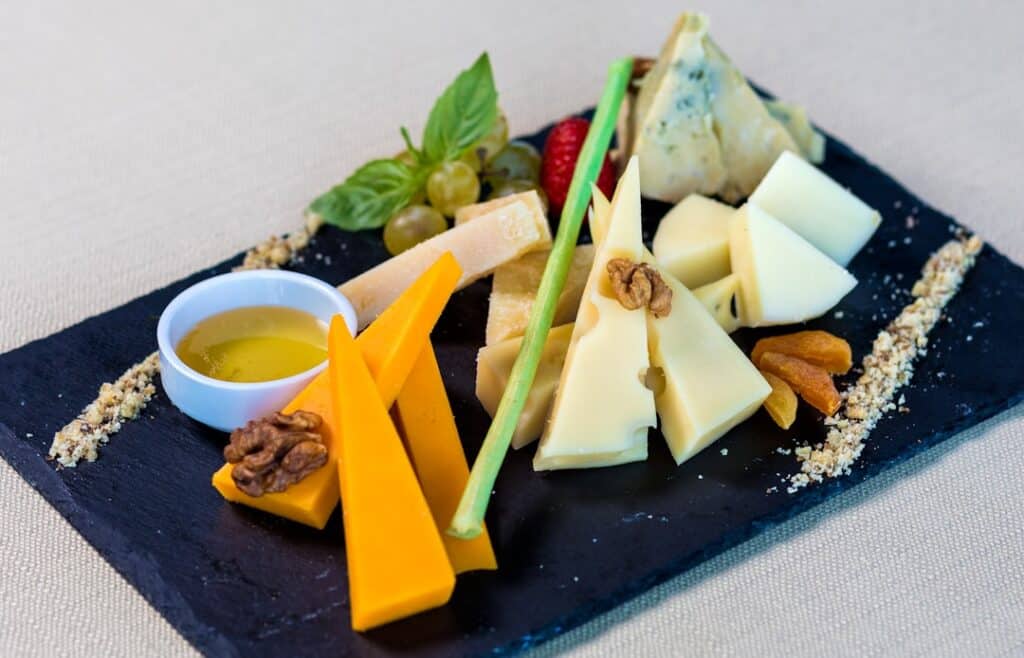 Modern, minimal photograph of a classic mousetrap baited with a piece of cheese, symbolizing the tempting but costly 'free...