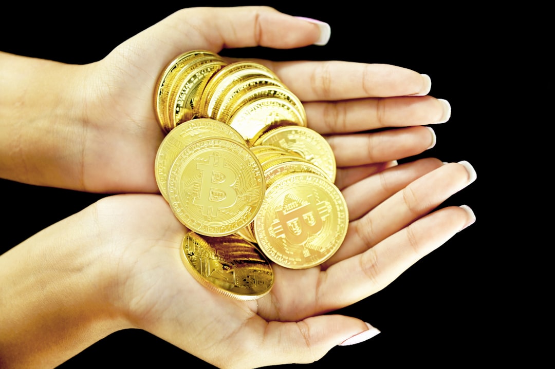 A professional, close-up shot of coins slipping through a person's fingers, representing the loss of commission earnings due to a brokerage's high-split model.