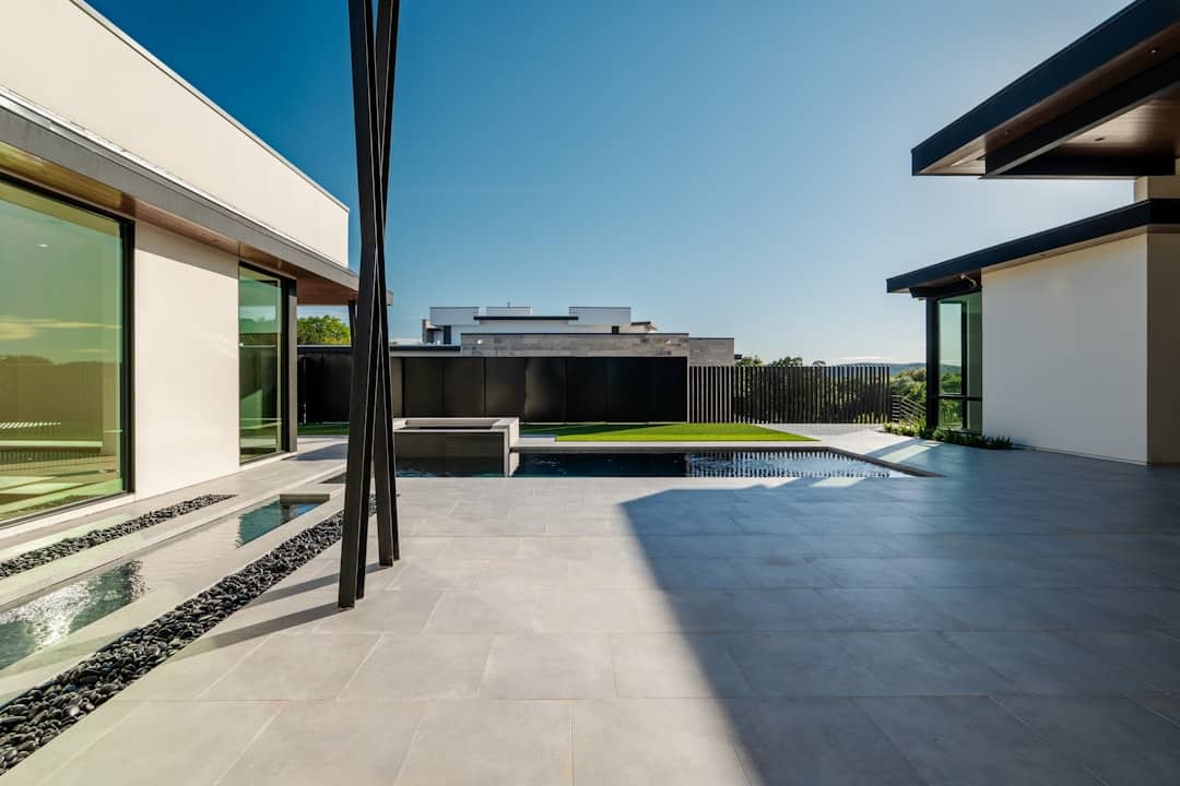 The clean, striking lines of a unique modern home stand out on a sunny day, representing a disruptive and successful real estate model.