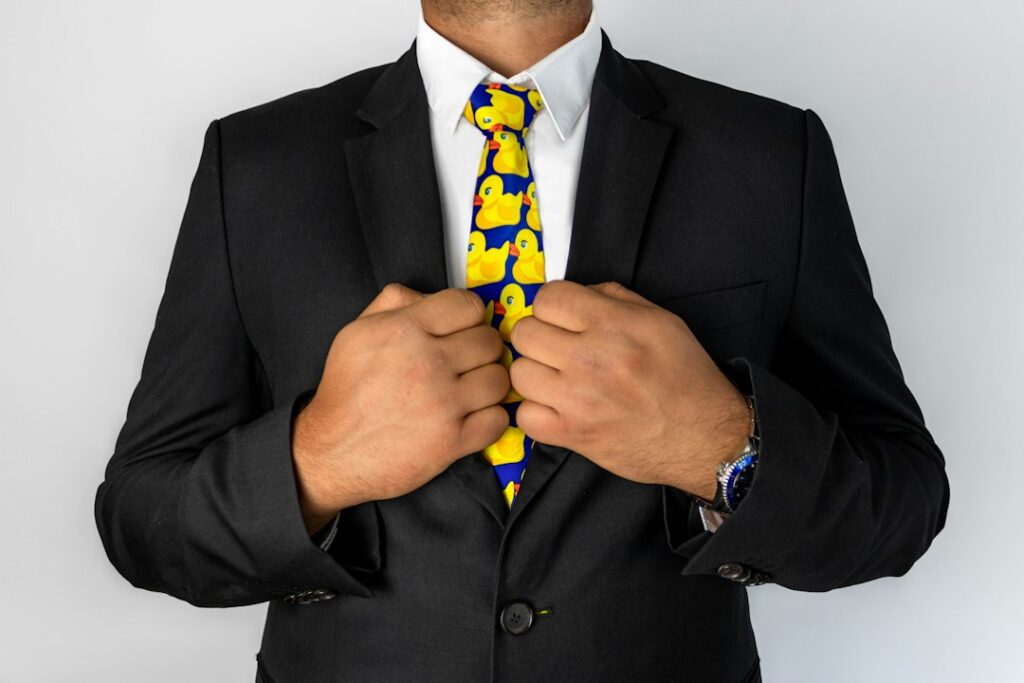 Real estate agent in a sharp business suit with their hands bound by golden handcuffs, symbolizing the restrictive nature ...