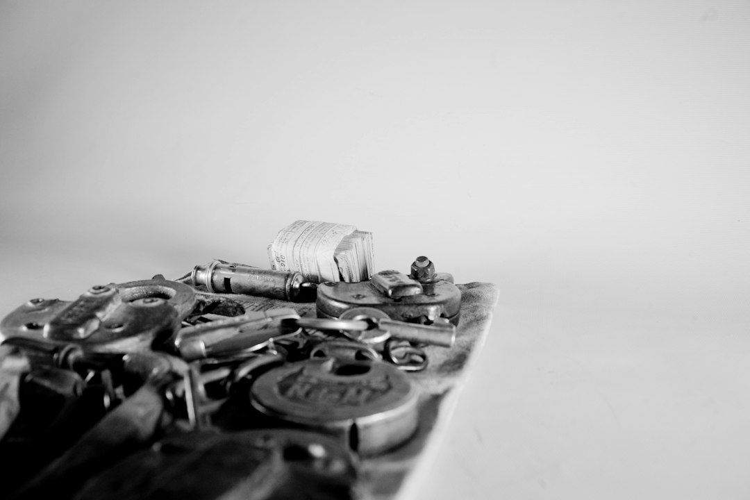 A single, sleek modern key rests on a pile of ornate, old-fashioned keys, illustrating the new, more efficient business model surpassing the outdated ones.