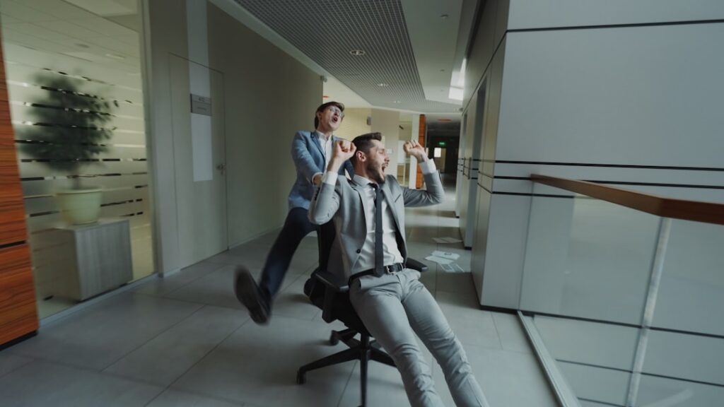 Successful real estate agent in a business suit runs on a treadmill inside a modern office, symbolizing the feeling of wor...