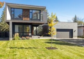 Clean, bright architectural lines of a modern luxury home, representing a new and better real estate business model.