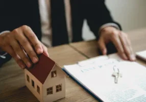 Real estate agent discussion about signing on paper financial contract at office agency